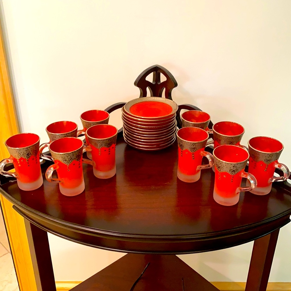 Beautiful 10 red teacups & 12 saucers with golden trim!